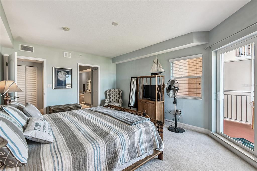 4516 Seagull Drive, Unit 807 New Port Richey, FL 34652 - Photo 23 of 100 a bedroom with a bed and a flat tv screen