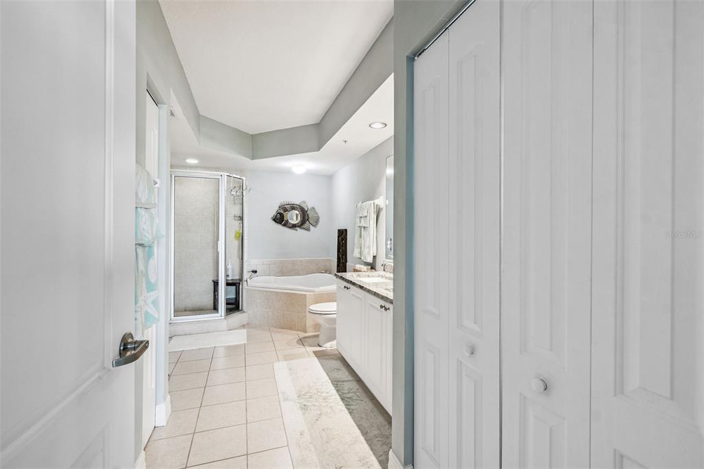 4516 Seagull Drive, Unit 807 New Port Richey, FL 34652 - Photo 27 of 100 a bathroom with a sink a toilet and shower