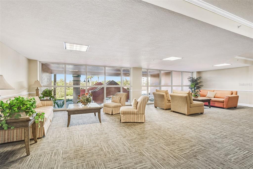 4516 Seagull Drive, Unit 807 New Port Richey, FL 34652 - Photo 51 of 100 a living room with furniture and a large window