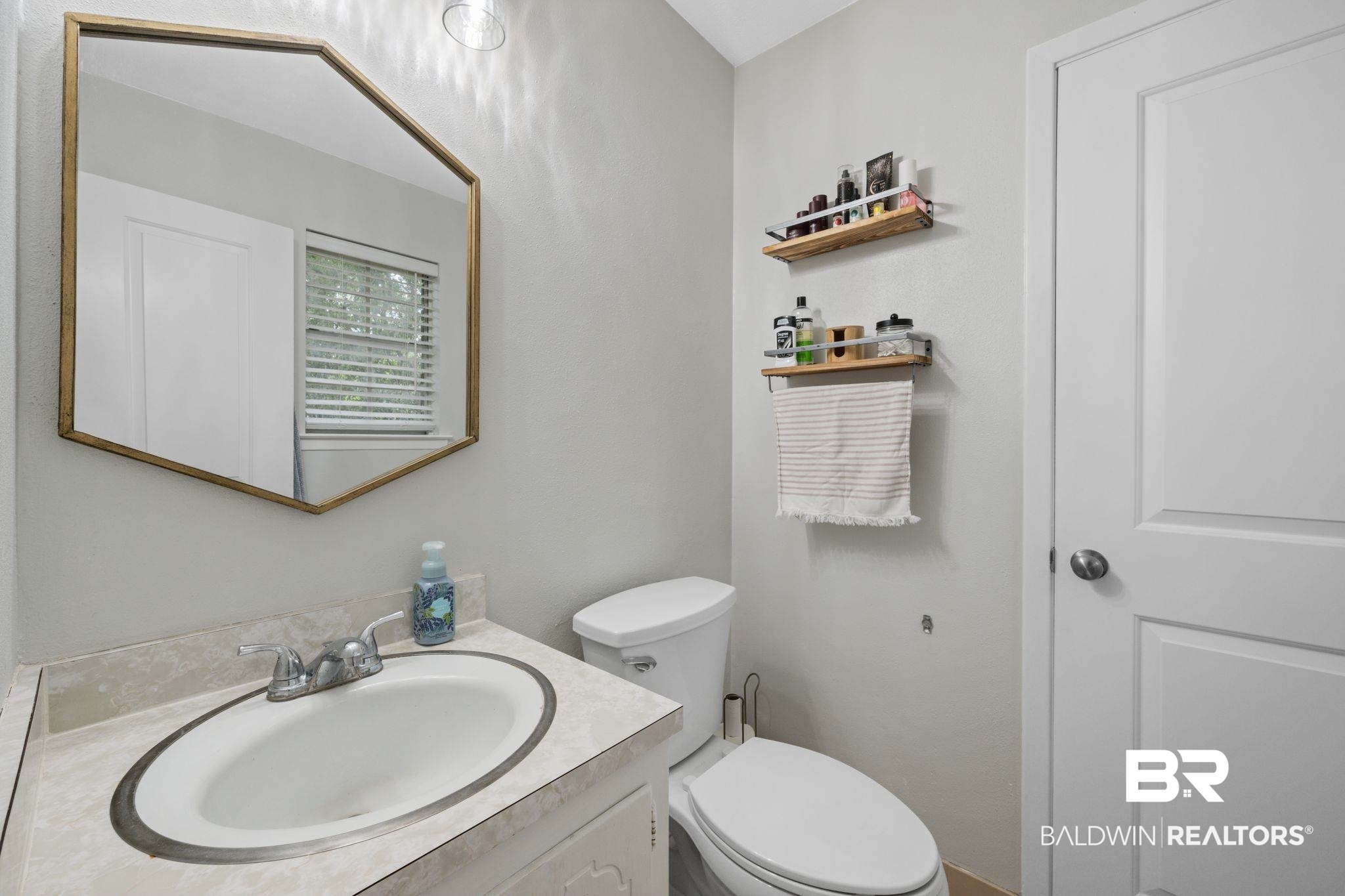 621 Ann Street Saraland, AL 36571 - Photo 10 of 21 Bathroom with vanity and toilet