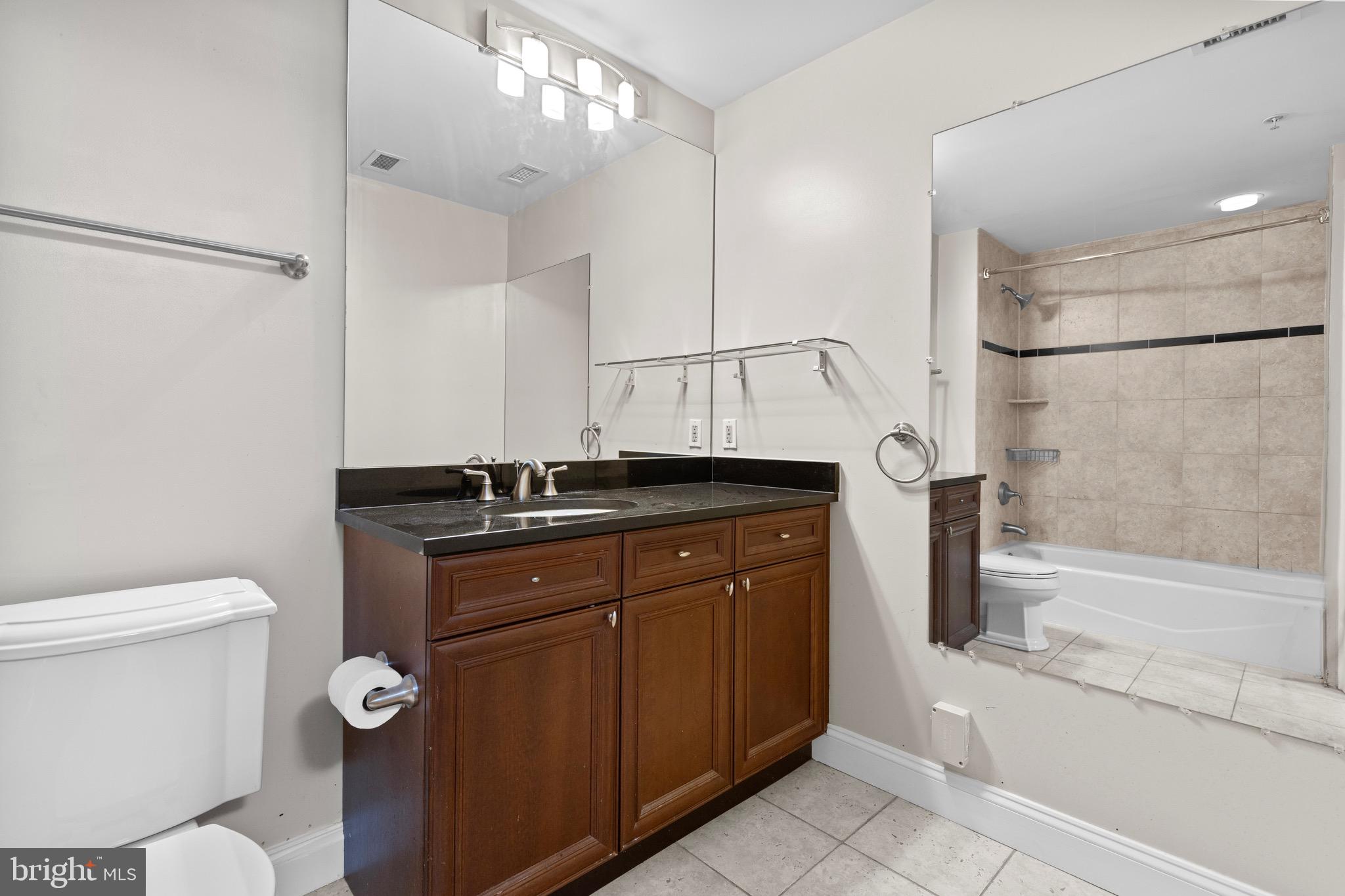 1210 R Street Northwest, Unit B1 Washington, DC 20009 - Photo 11 of 15 a bathroom with a sink a toilet and shower