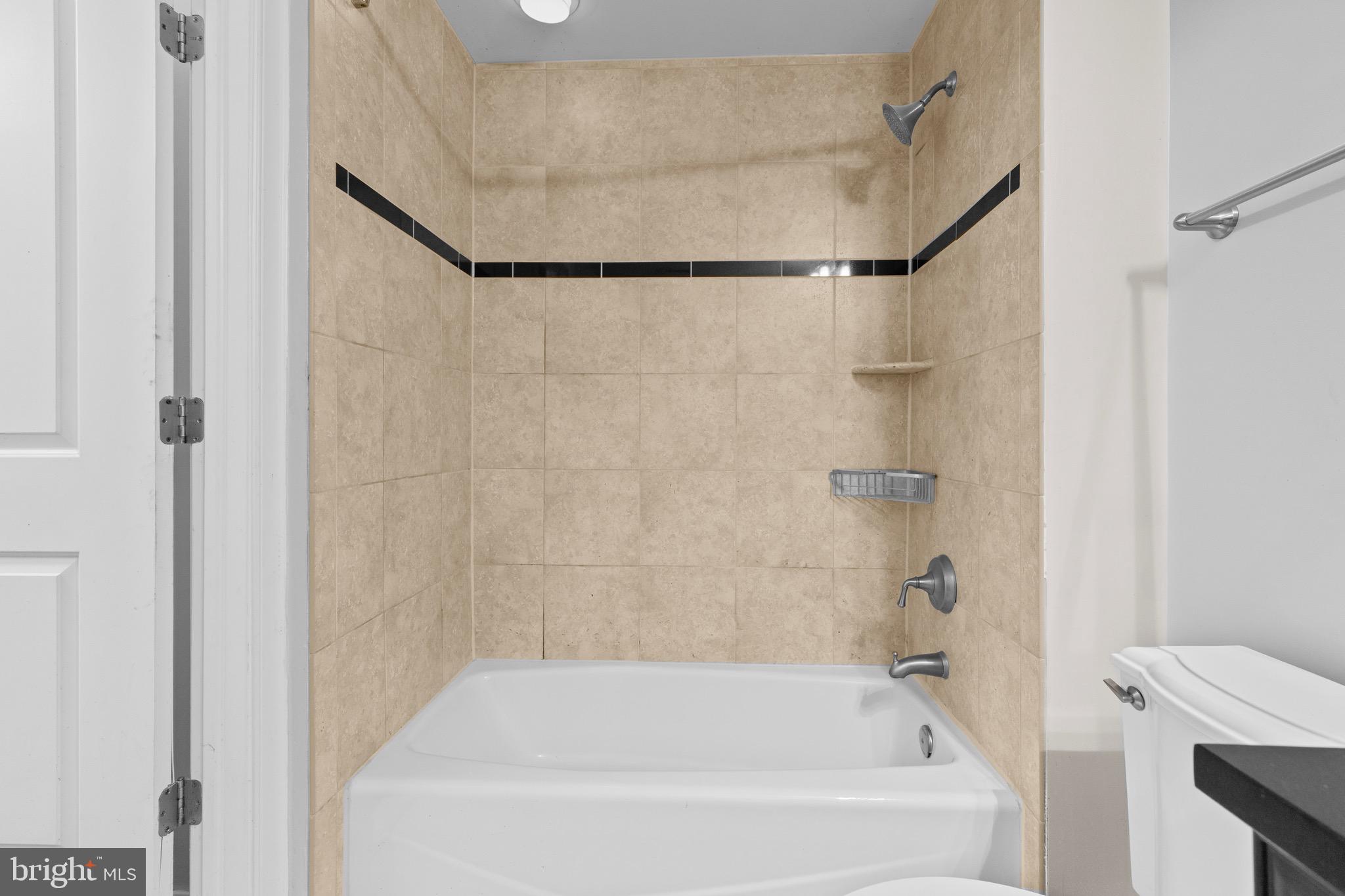 1210 R Street Northwest, Unit B1 Washington, DC 20009 - Photo 12 of 15 a bathroom with a bathtub and a shower