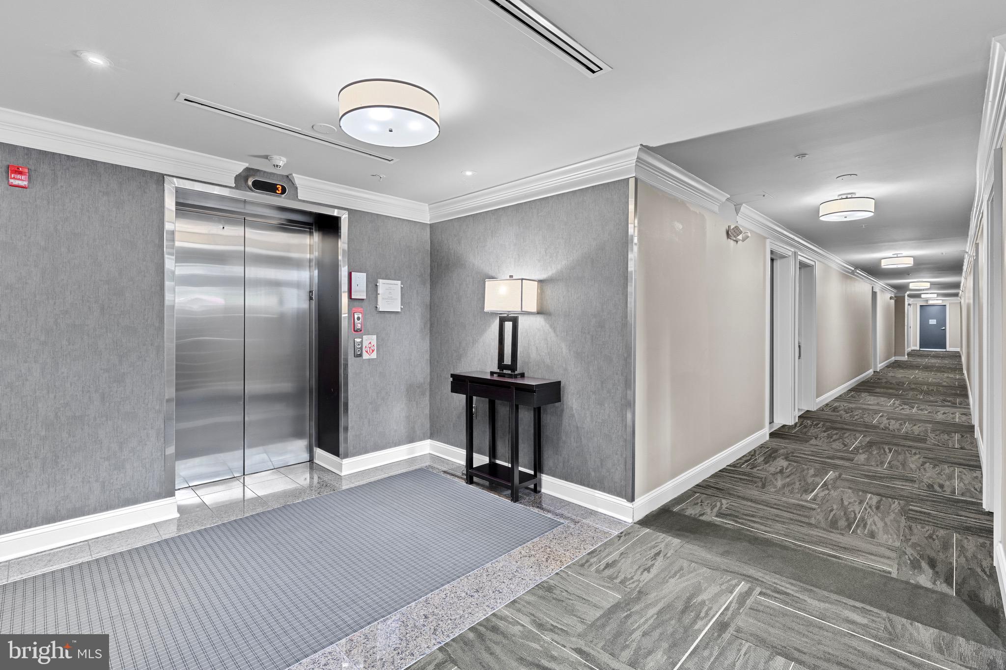 1210 R Street Northwest, Unit B1 Washington, DC 20009 - Photo 15 of 15 a view of a hallway with a chandelier