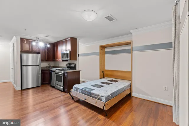 a kitchen with a refrigerator and a sink