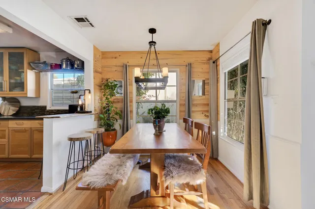 a kitchen with stainless steel appliances a sink stove and refrigerator