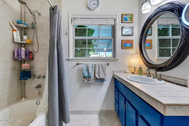 a view of a workspace with furniture and wooden floor