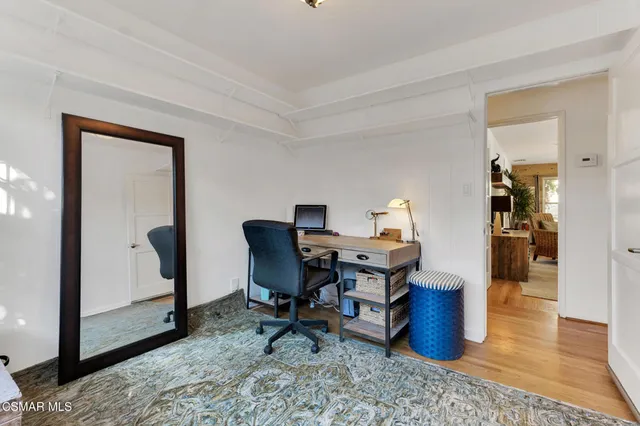 a workspace with furniture and window