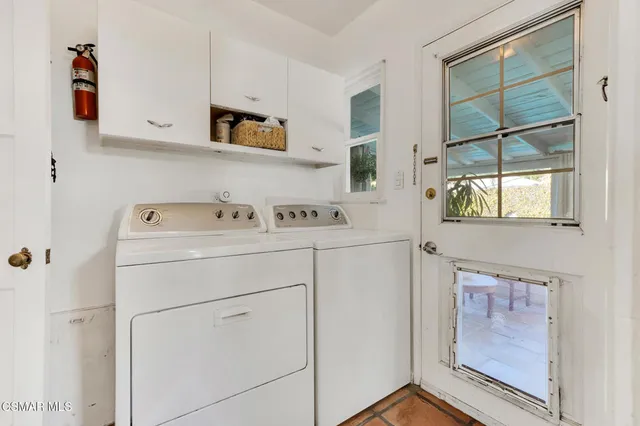 swimming pool view with a seating space