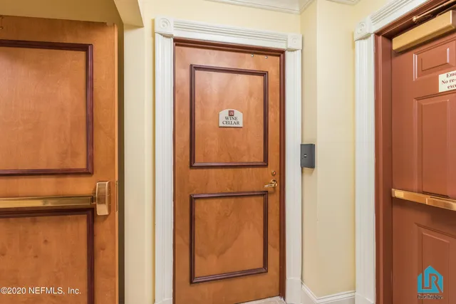 a view of multi story residential apartment building with a garden and plants