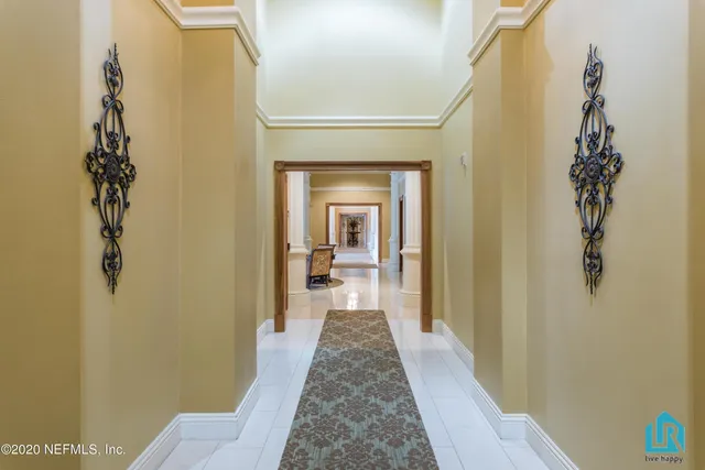 a view of empty room with wooden floor and fireplace