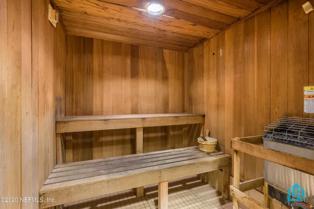 a kitchen with stainless steel appliances granite countertop a refrigerator and a stove