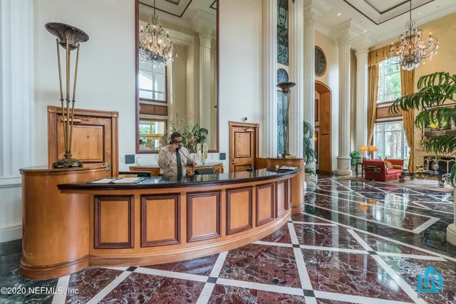 a view of balcony with wooden floor and fence
