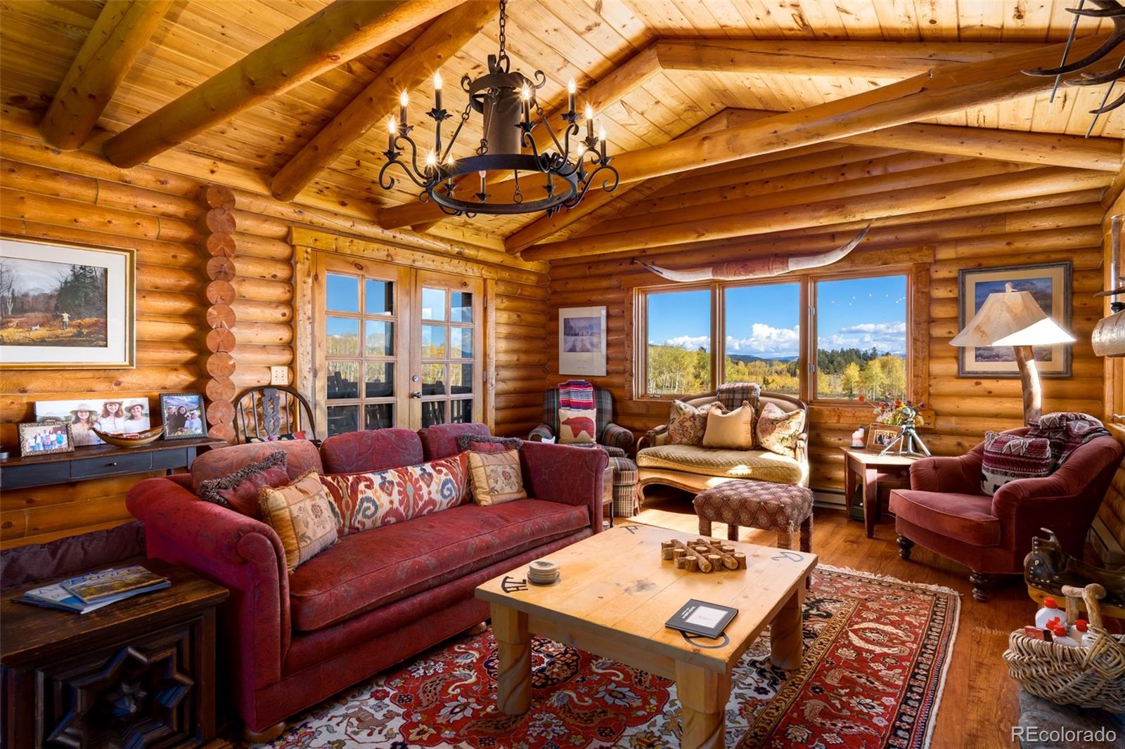 34755 Long Ridge Drive Toponas, CO 80479 - Photo 14 of 40 a living room with furniture a couch and a chandelier