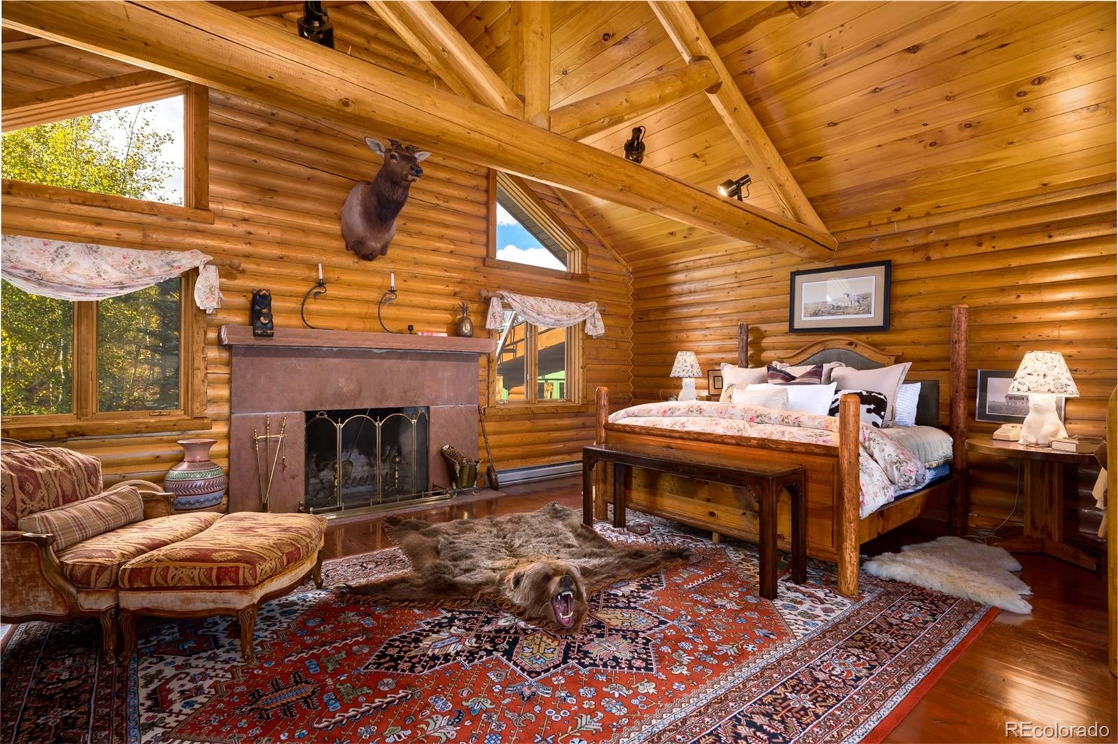 34755 Long Ridge Drive Toponas, CO 80479 - Photo 16 of 40 a bedroom with furniture and a fireplace