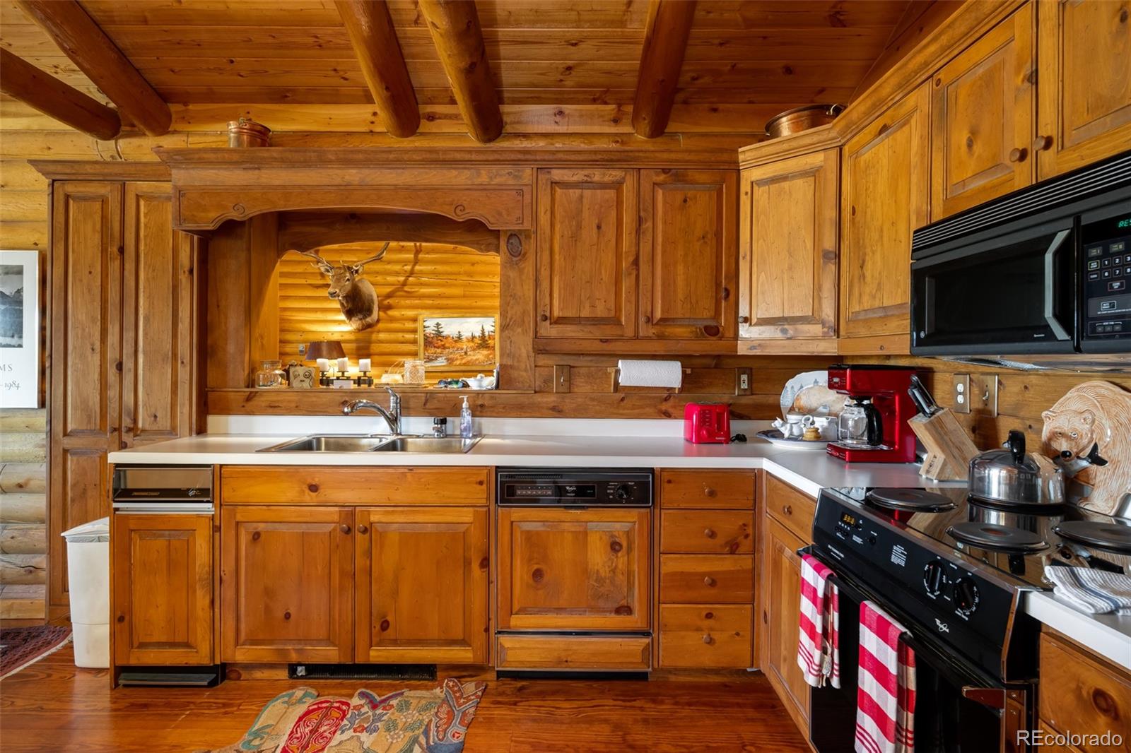 34755 Long Ridge Drive Toponas, CO 80479 - Photo 25 of 40 a kitchen with stainless steel appliances granite countertop a stove and a sink