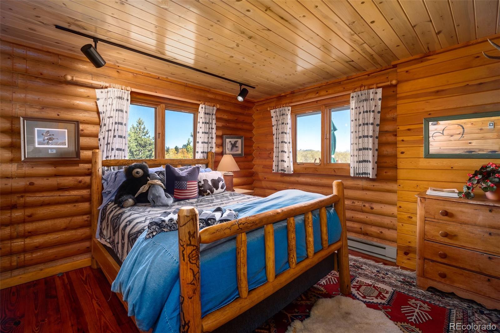 34755 Long Ridge Drive Toponas, CO 80479 - Photo 26 of 40 a view of a bedroom with furniture and windows