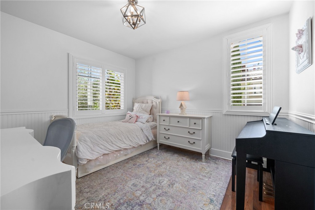 128 White Flower Irvine, CA 92603 - Photo 11 of 13 a bedroom with furniture and windows