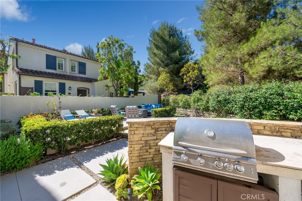 128 White Flower Irvine, CA 92603 - Photo 13 of 13 front view of a building with a garden