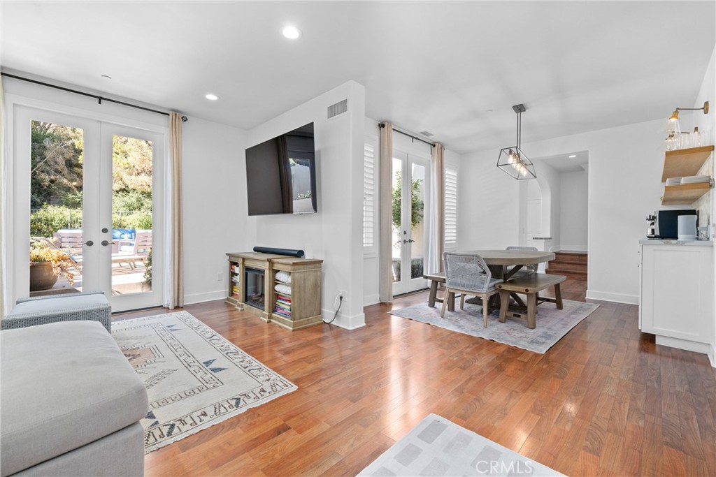 128 White Flower Irvine, CA 92603 - Photo 4 of 13 a living room with furniture and a flat screen tv