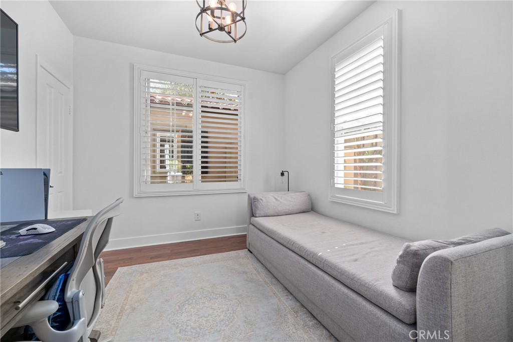 128 White Flower Irvine, CA 92603 - Photo 5 of 13 a bedroom with a bed and a window