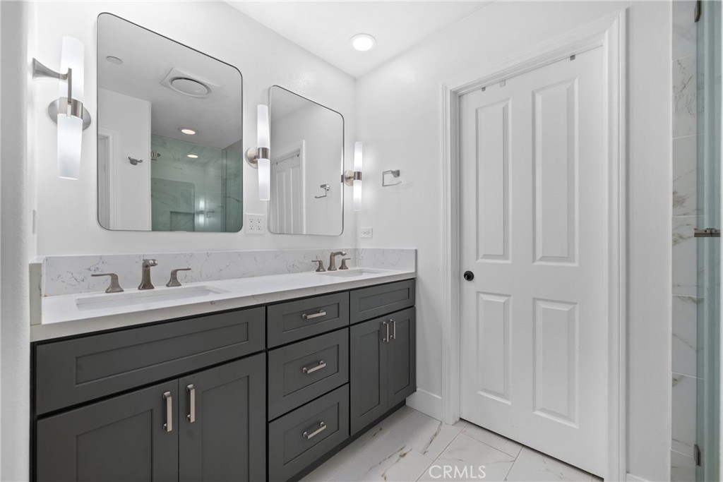 128 White Flower Irvine, CA 92603 - Photo 8 of 13 a bathroom with double sink and a mirror