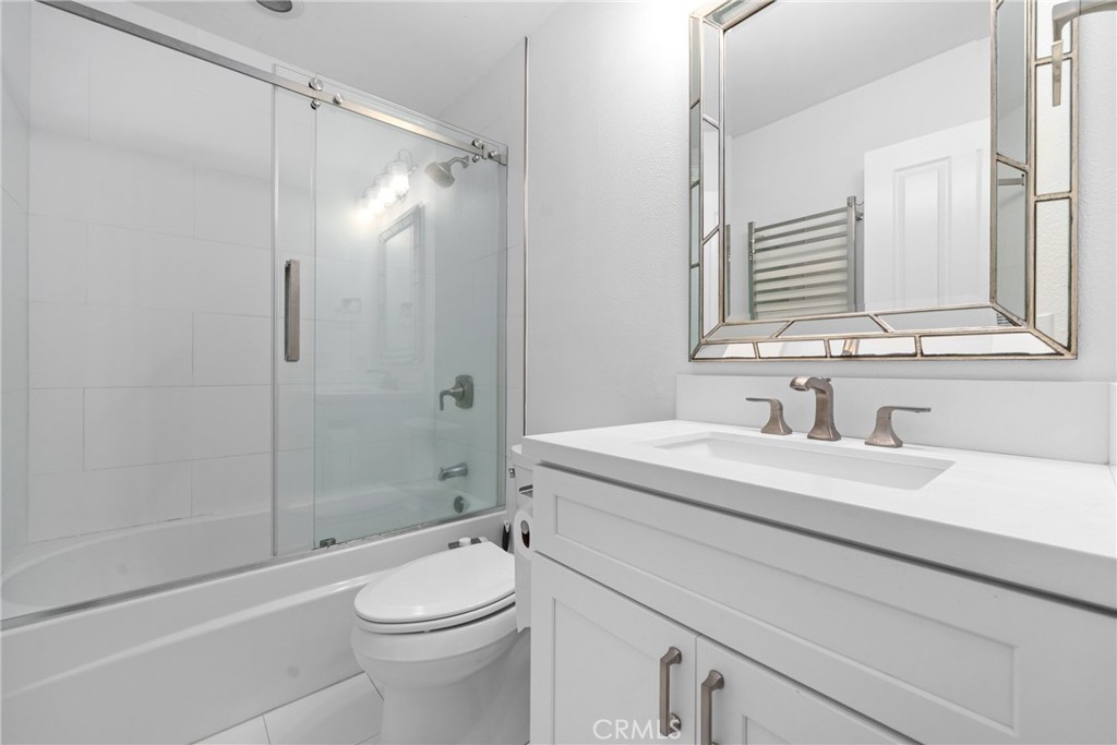 128 White Flower Irvine, CA 92603 - Photo 10 of 13 a bathroom with a sink a toilet and shower