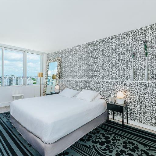 1100 West Avenue, Unit 1004 Miami Beach, FL 33139 - Photo 12 of 22 a bedroom with a bed and a window
