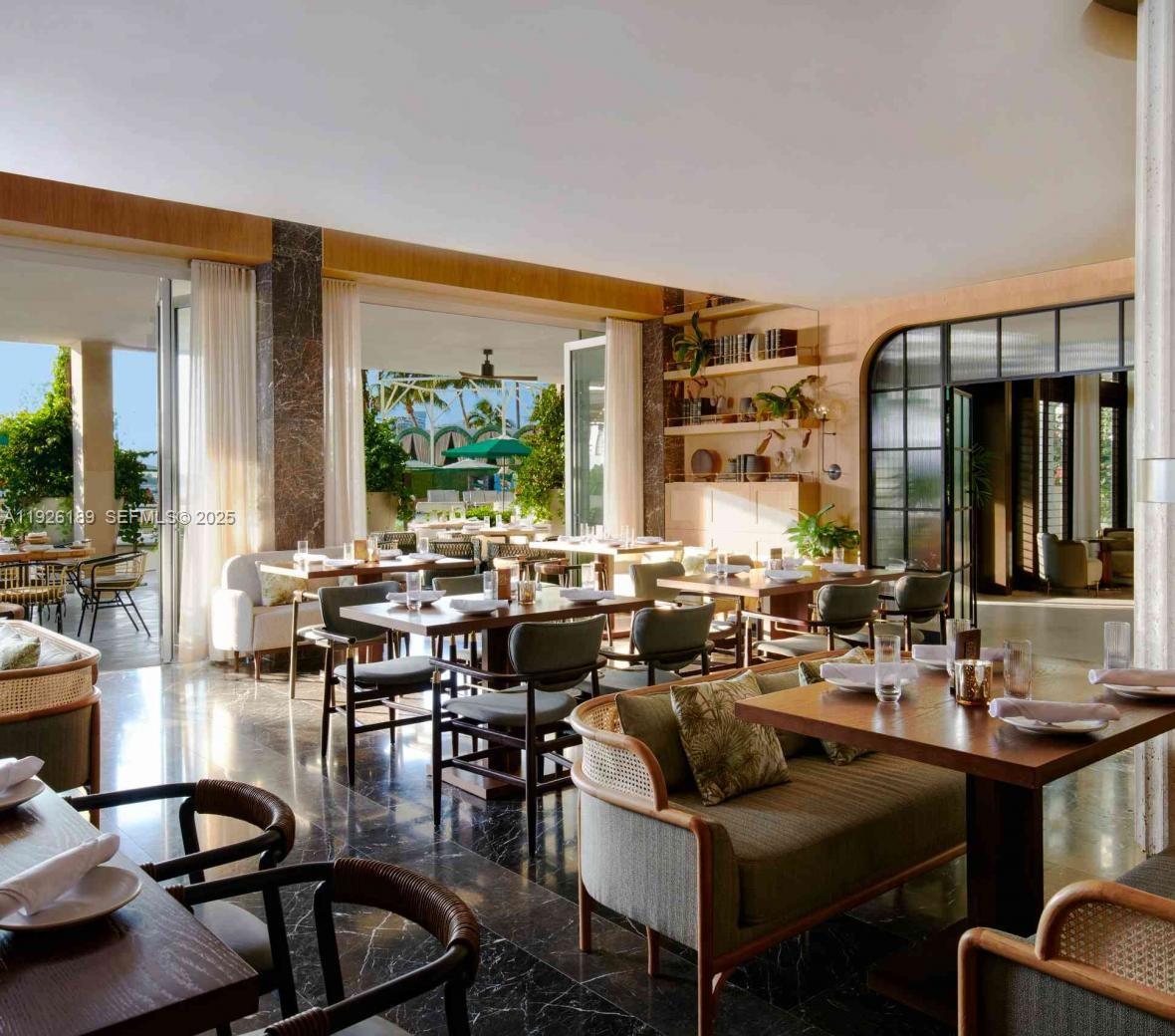 1100 West Avenue, Unit 1004 Miami Beach, FL 33139 - Photo 16 of 22 a very nice looking living room with a large window and dining table