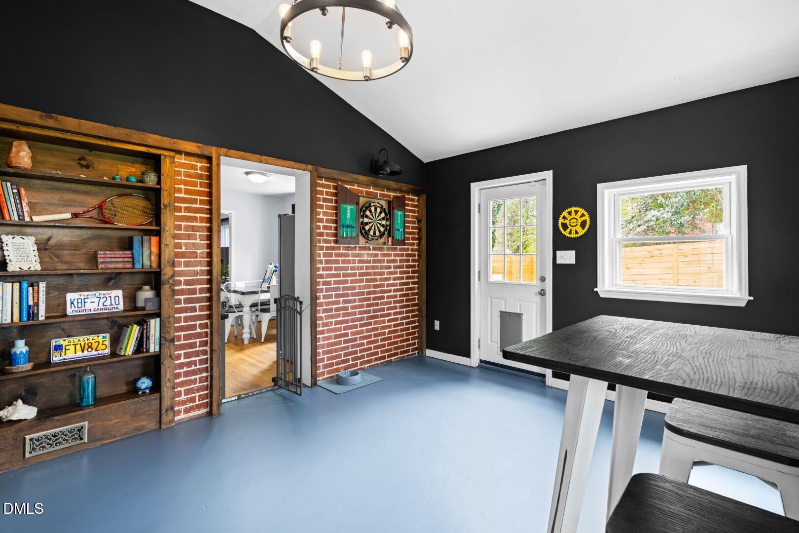 1405 Marlborough Road Raleigh, NC 27610 - Photo 15 of 33 a view of an empty room with bookshelf and a large window
