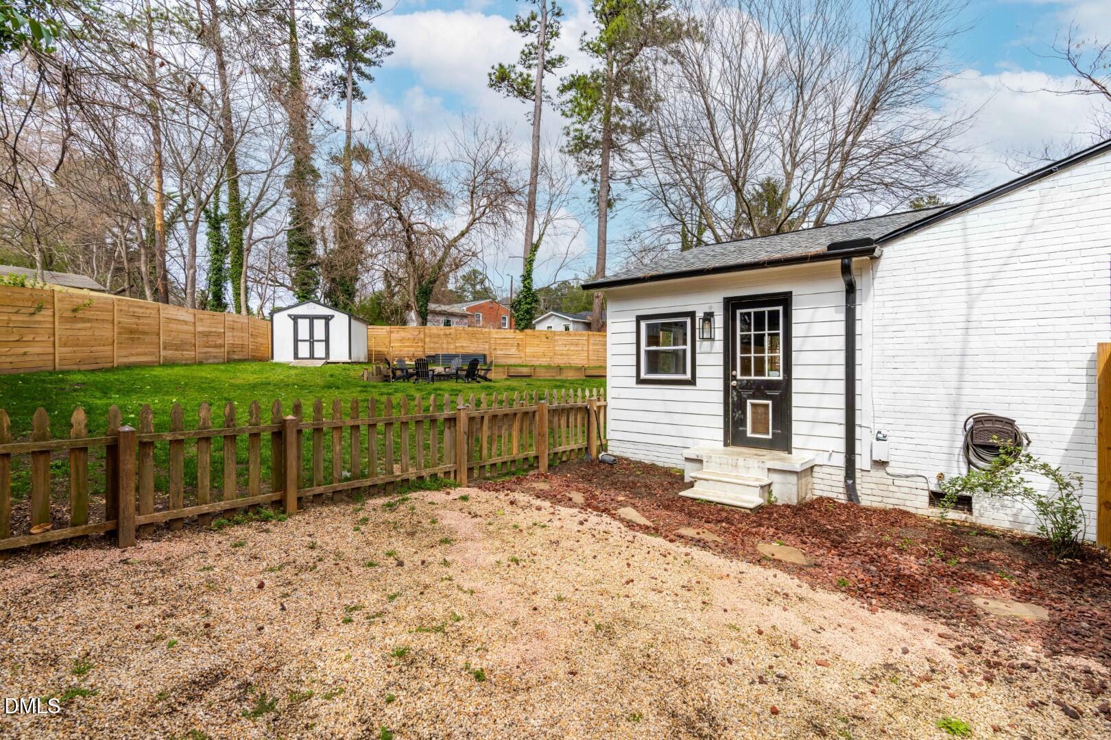 1405 Marlborough Road Raleigh, NC 27610 - Photo 23 of 33 a view of a house with a yard covered in snow