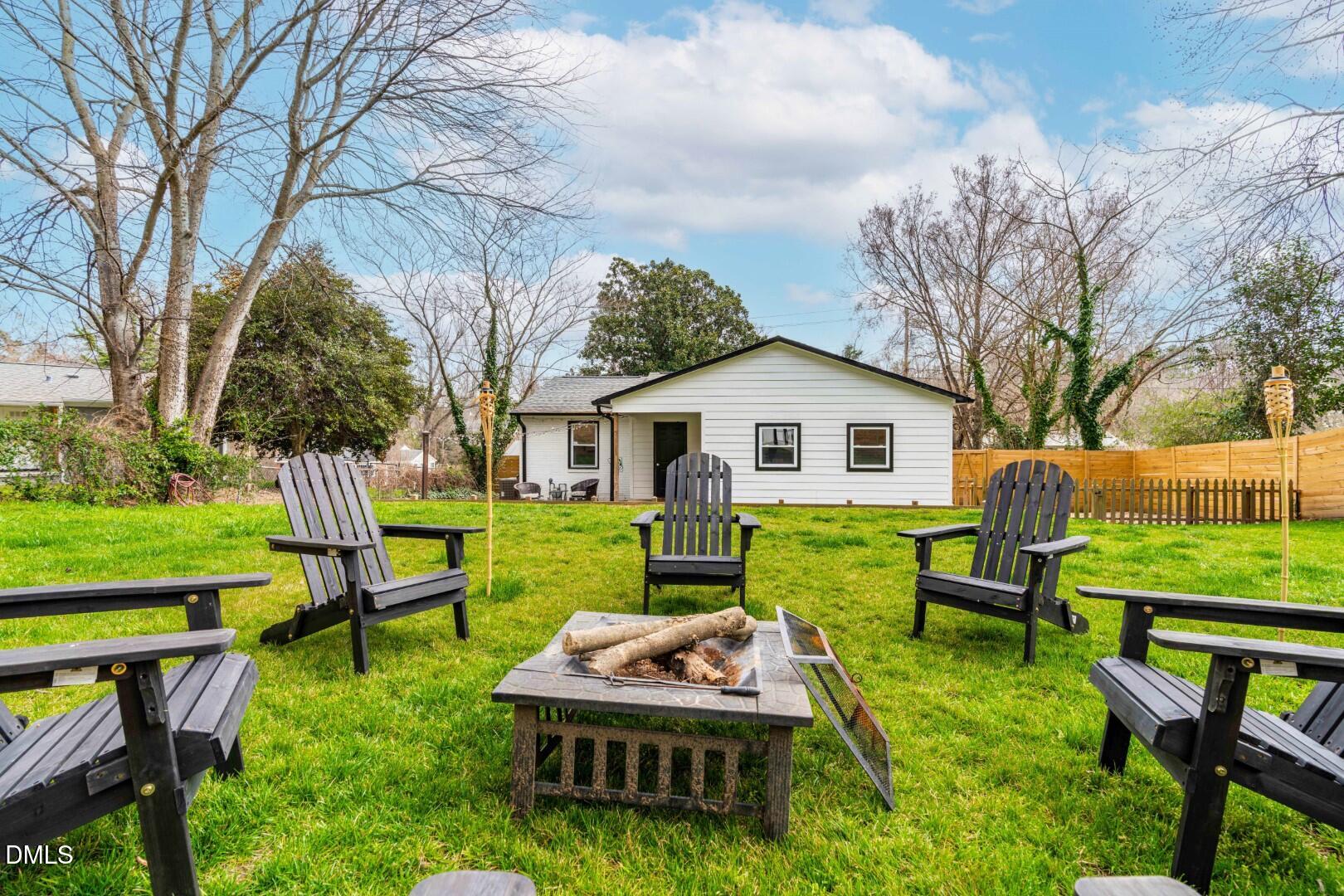 1405 Marlborough Road Raleigh, NC 27610 - Photo 26 of 33 a front view of house with a garden and trees