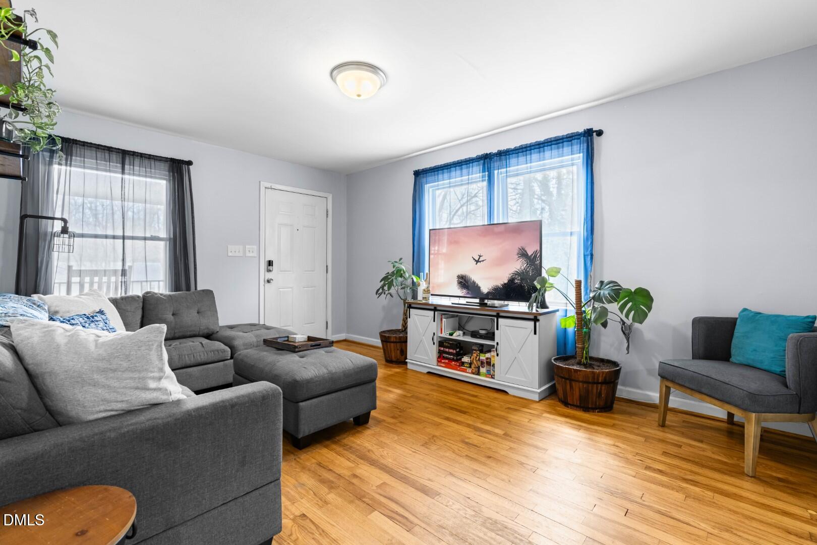 1405 Marlborough Road Raleigh, NC 27610 - Photo 6 of 33 a living room with furniture and a wooden floor