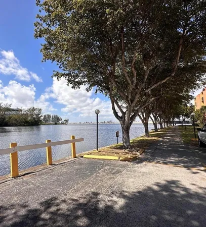 a view of swimming pool with a yard