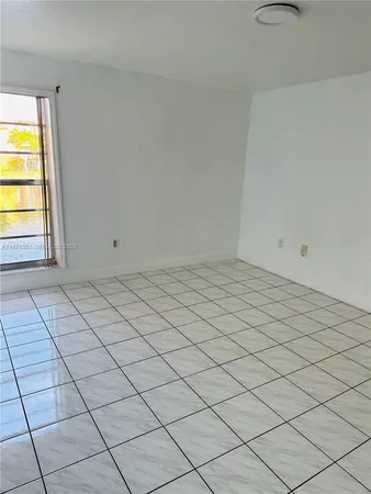 a view of an empty room and window