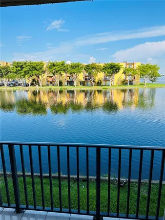 a white refrigerator freezer and a stove sitting inside of a kitchen