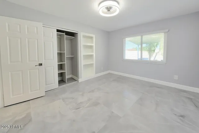 an empty room with windows