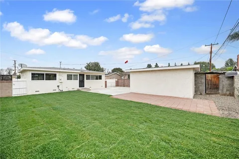 a view of a backyard of the house