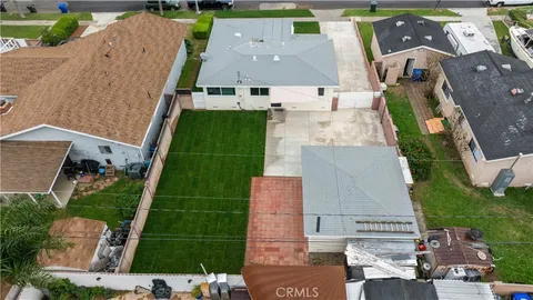 an aerial view of a city with lots of residential buildings