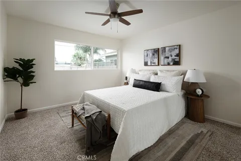 a bed room with a bed and a window