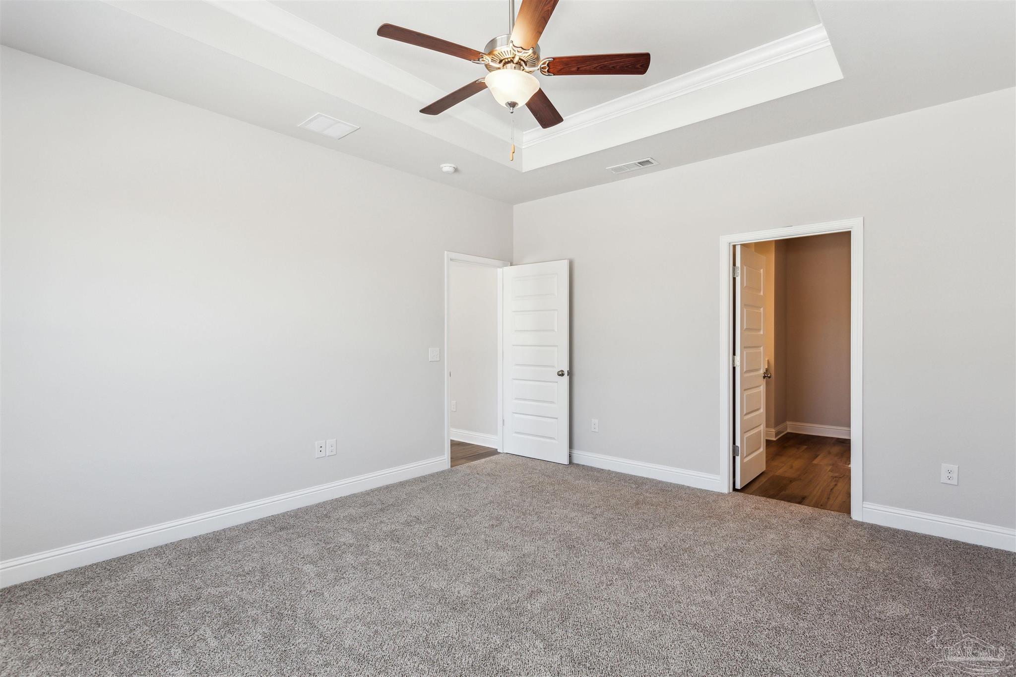 1648 Slate Drive Cantonment, FL 32533 - Photo 18 of 31 an empty room with closet and a ceiling fan