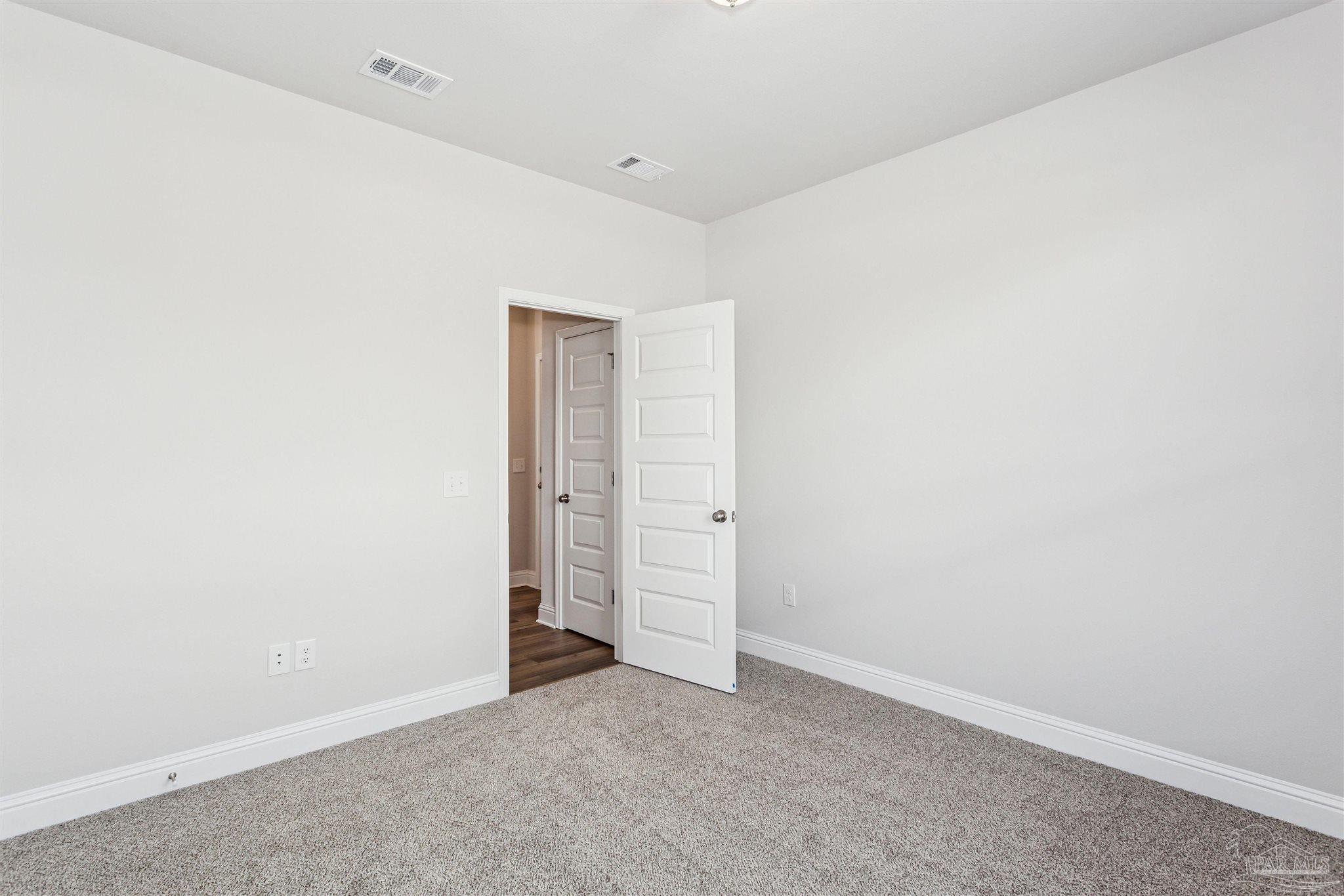 1648 Slate Drive Cantonment, FL 32533 - Photo 29 of 31 an empty room with closet