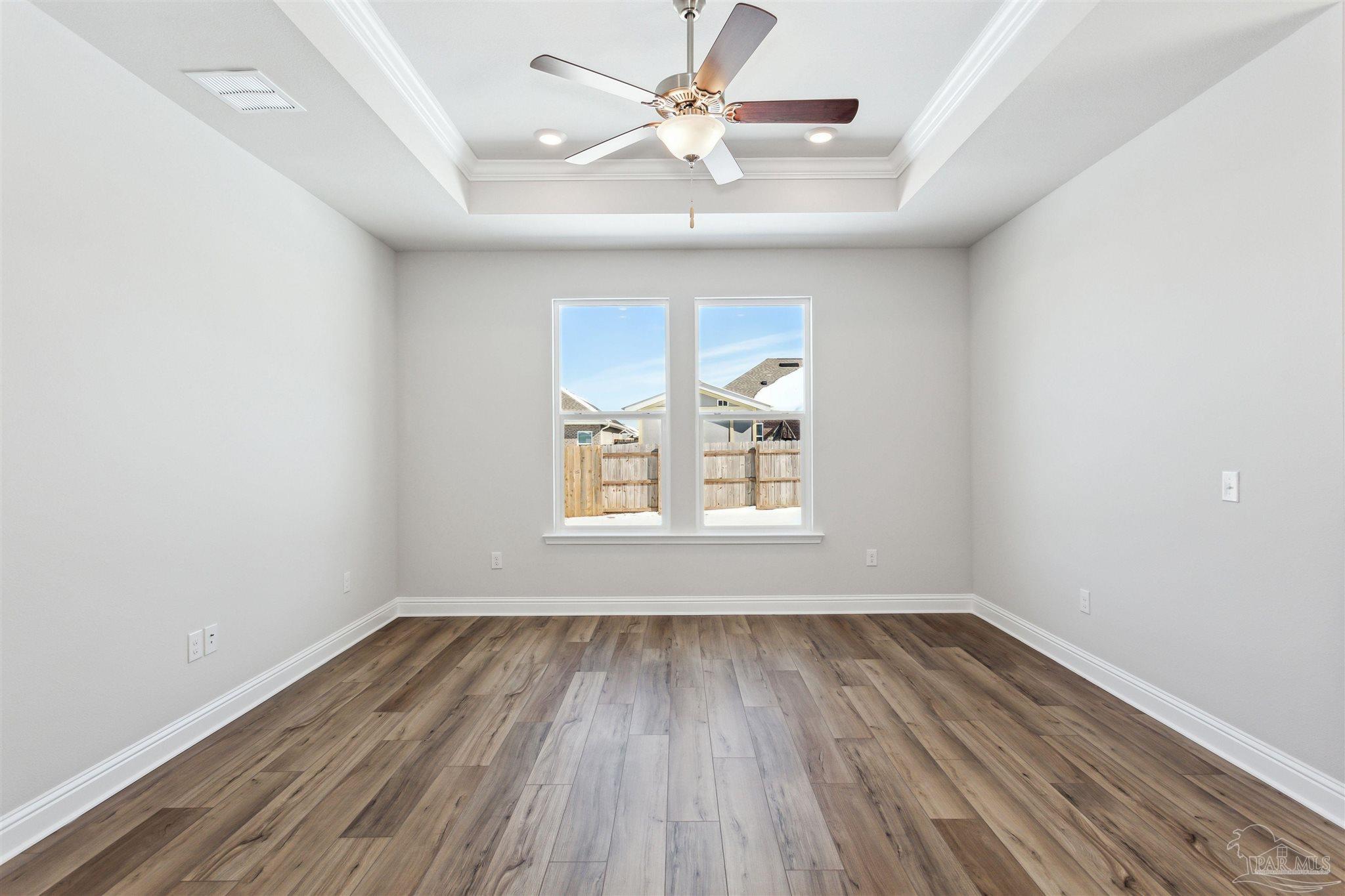 1648 Slate Drive Cantonment, FL 32533 - Photo 10 of 31 wooden floor in an empty room with a window
