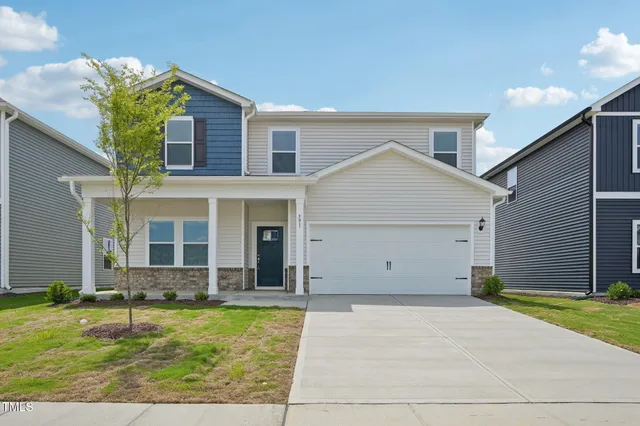 a view of house with yard