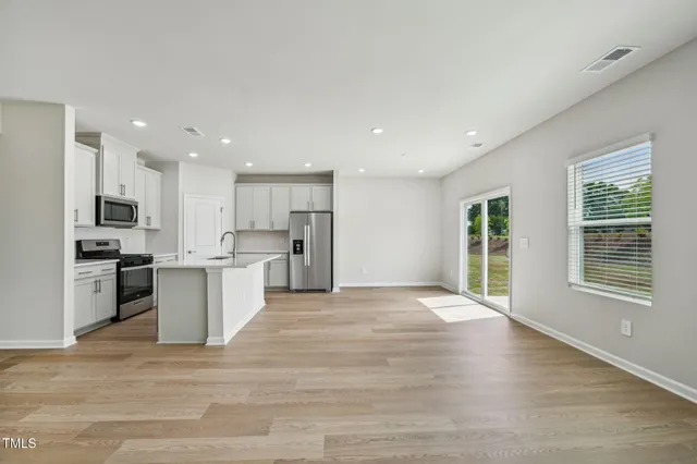 a view of kitchen with wooden floor