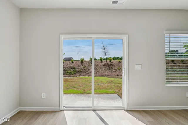 a kitchen with a refrigerator a sink and a stove top oven
