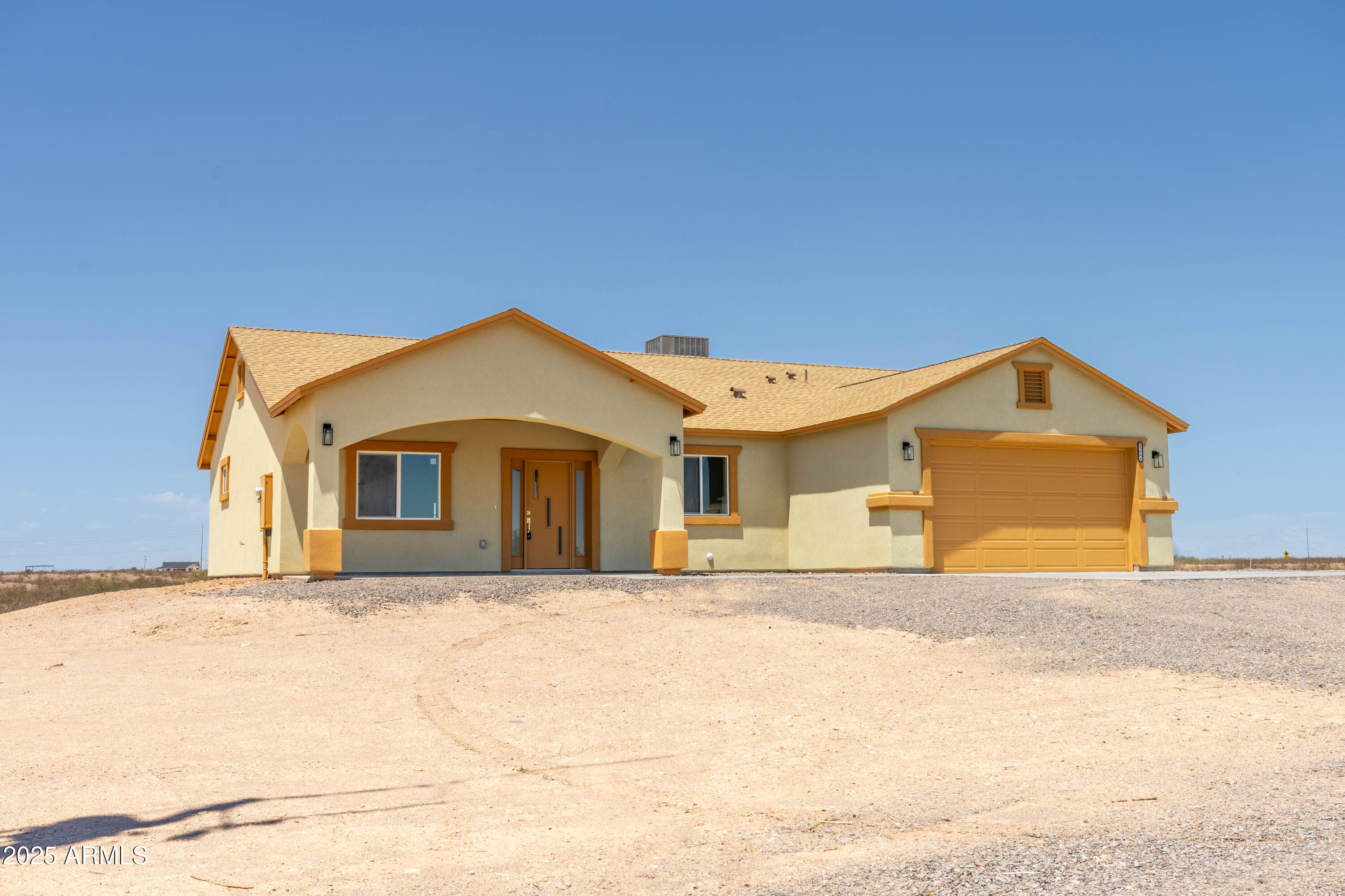 35684 West Chipman Road Tonopah, AZ 85354 - Photo 2 of 39 a front view of a house with a yard