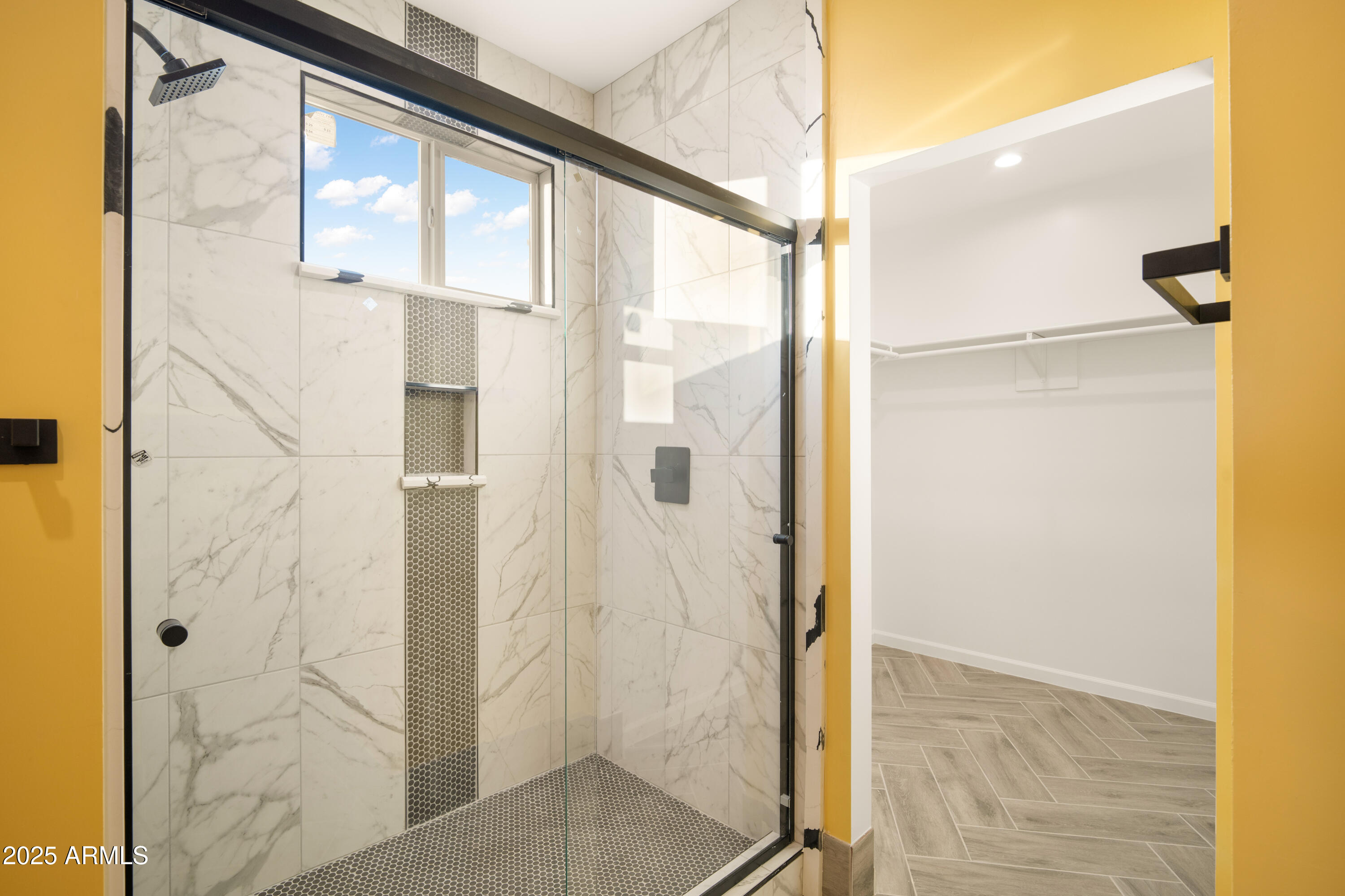 35684 West Chipman Road Tonopah, AZ 85354 - Photo 21 of 39 a bathroom with a glass shower door and mirror