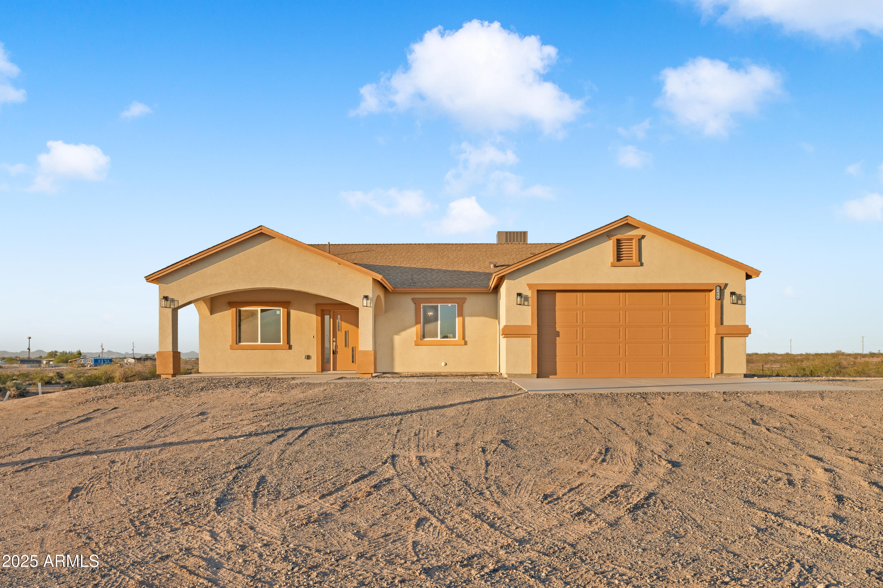 35684 West Chipman Road Tonopah, AZ 85354 - Photo 37 of 39 a front view of a house with a yard