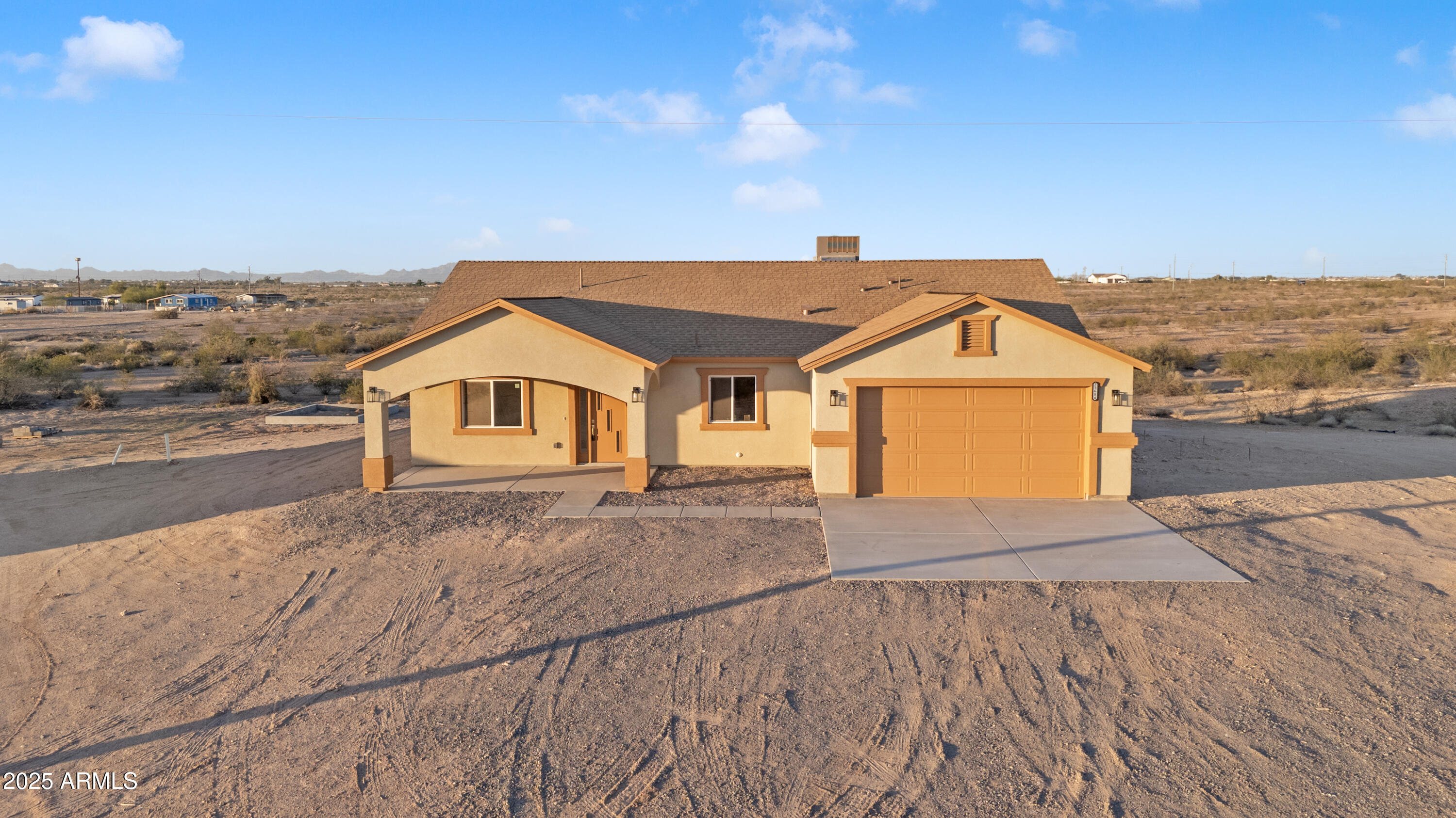 35684 West Chipman Road Tonopah, AZ 85354 - Photo 38 of 39 a view of a house with a road