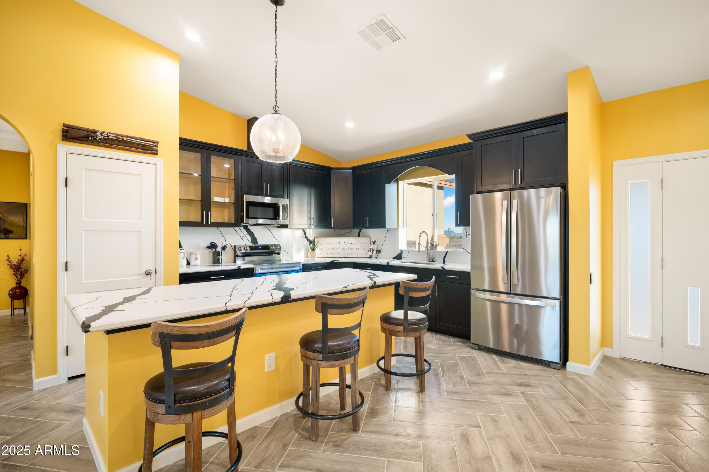 35684 West Chipman Road Tonopah, AZ 85354 - Photo 4 of 39 a large kitchen with a table and chairs